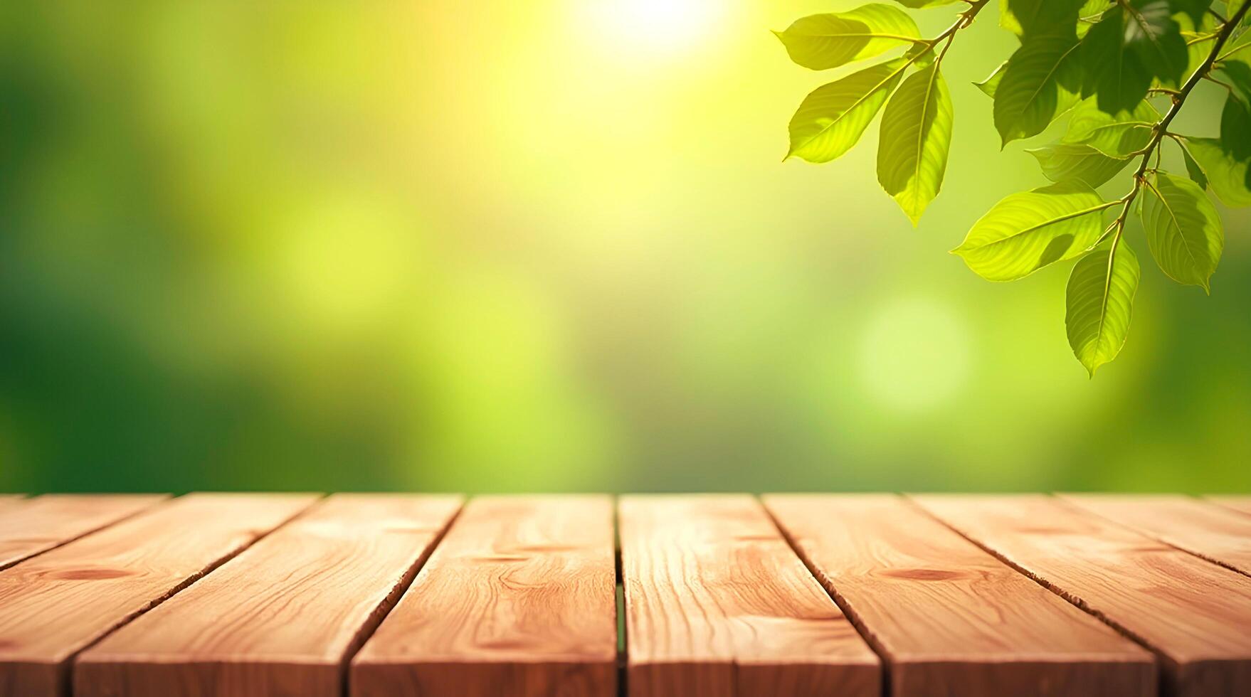 Background for design with empty wooden table, table top on green blurred background with bokeh effect, green leaves on top and sunlight. photo