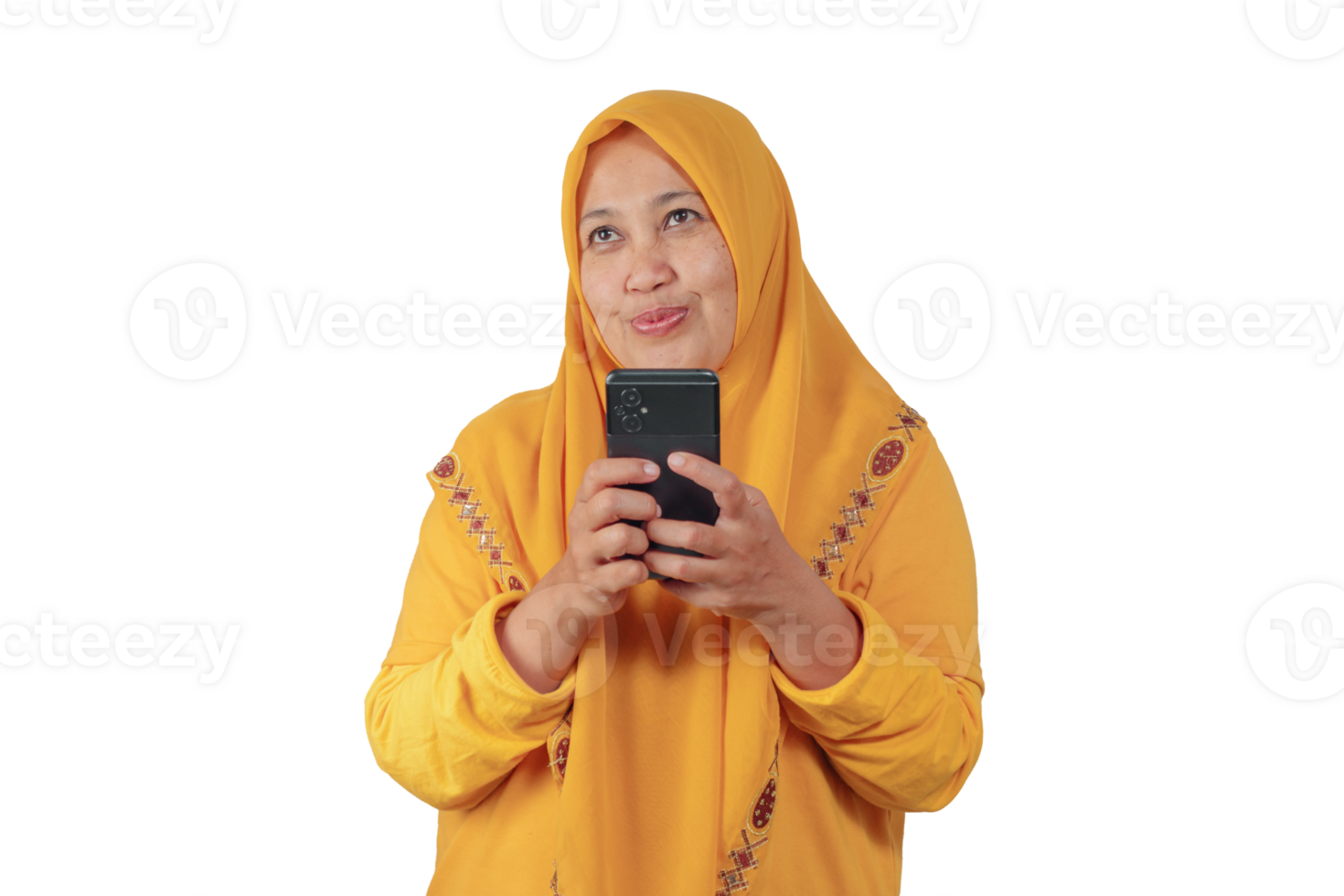 Southeast Asian woman in yellow hijab smiling and holding smartphone while daydreaming png