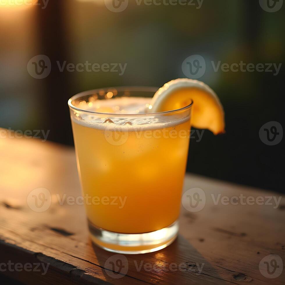 Refreshing Orange Drink with Lemon Slice on Wooden Table photo