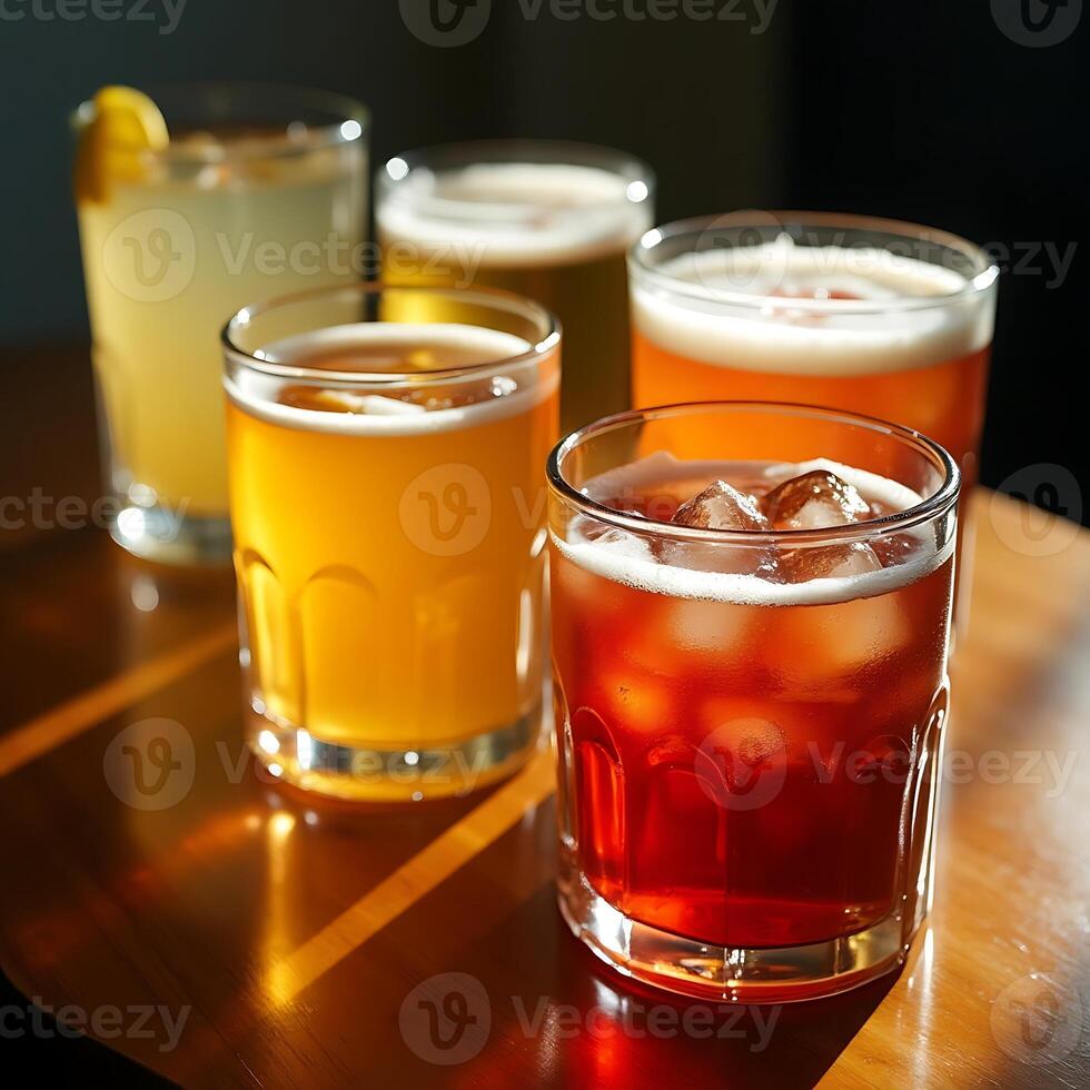 Serving Assorted Drinks with Ice in Glasses on a Wooden Table photo