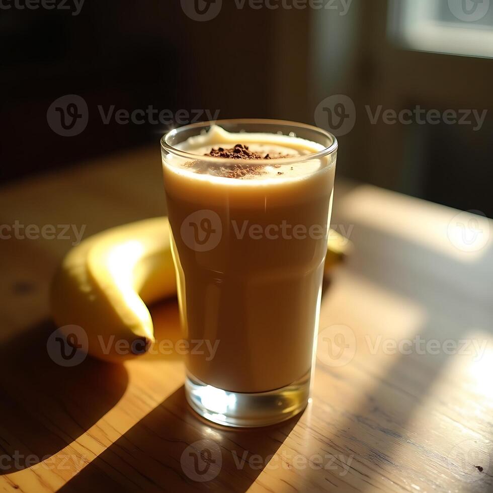 Enjoying Banana Smoothie with Chocolate Topping on Wooden Table photo
