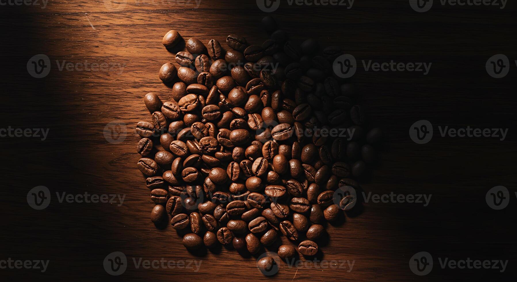 Coffee Beans on Wood Grain Surface with Dramatic Lighting photo