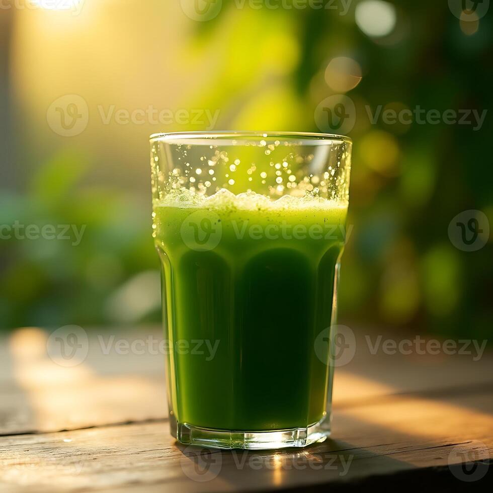 Green Juice Drink on Table with Bokeh Background photo