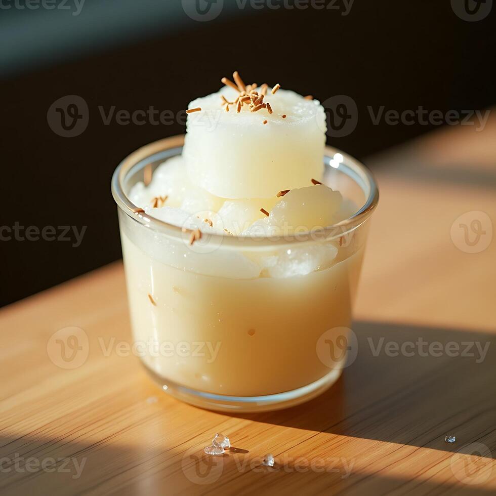 Serving Refreshing Frozen Treat in Glass on Wooden Table photo