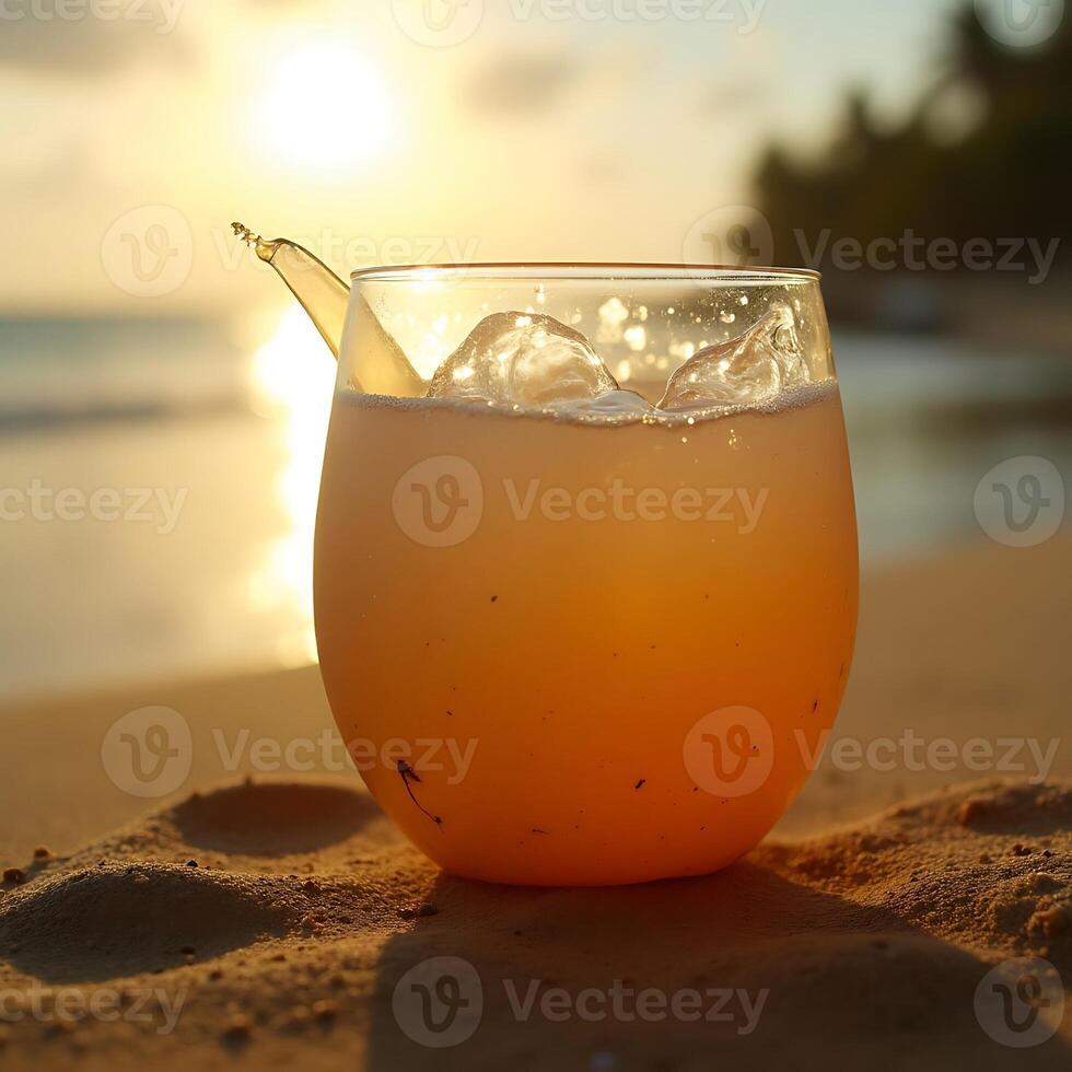 Refreshing Drink on Beach at Sunset with Ice Cubes photo