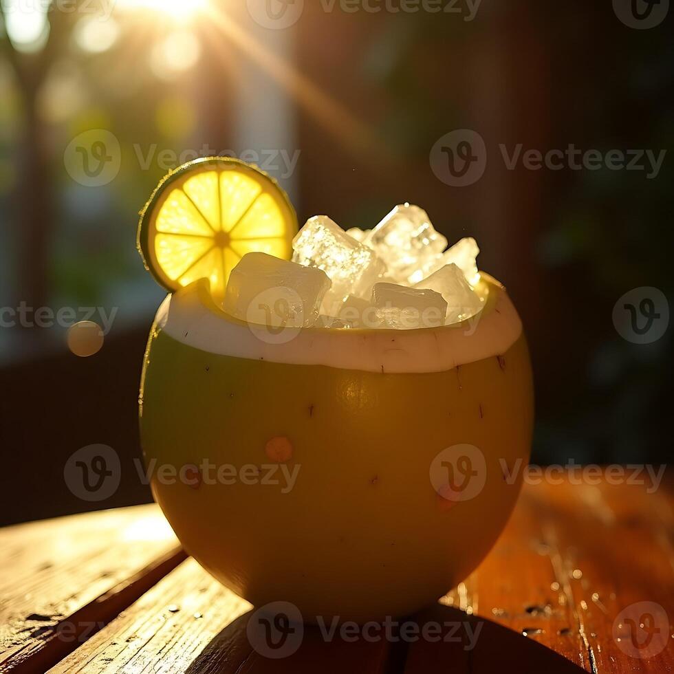 Serving Ice Drink in Coconut Shell with Lime Slice on Wood Table photo