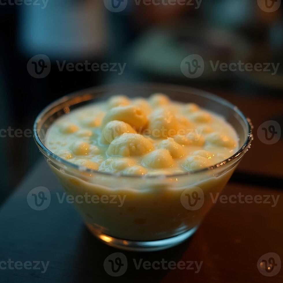 Serving Gnocchi in Creamy Sauce in a Glass Bowl photo