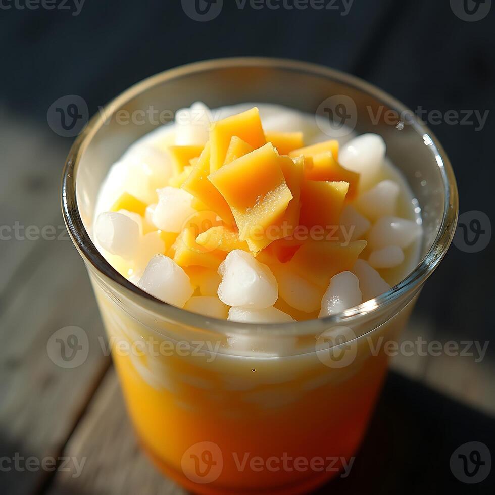 Mango Dessert in Glass with Tapioca Pearls and Sweet Cream photo