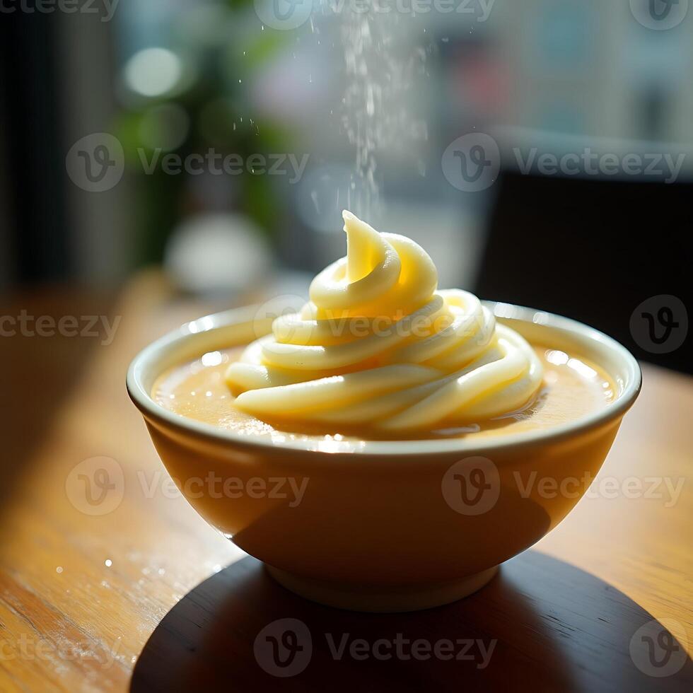 Dessert in Bowl with Sprinkling of Powdered Sugar on Table photo
