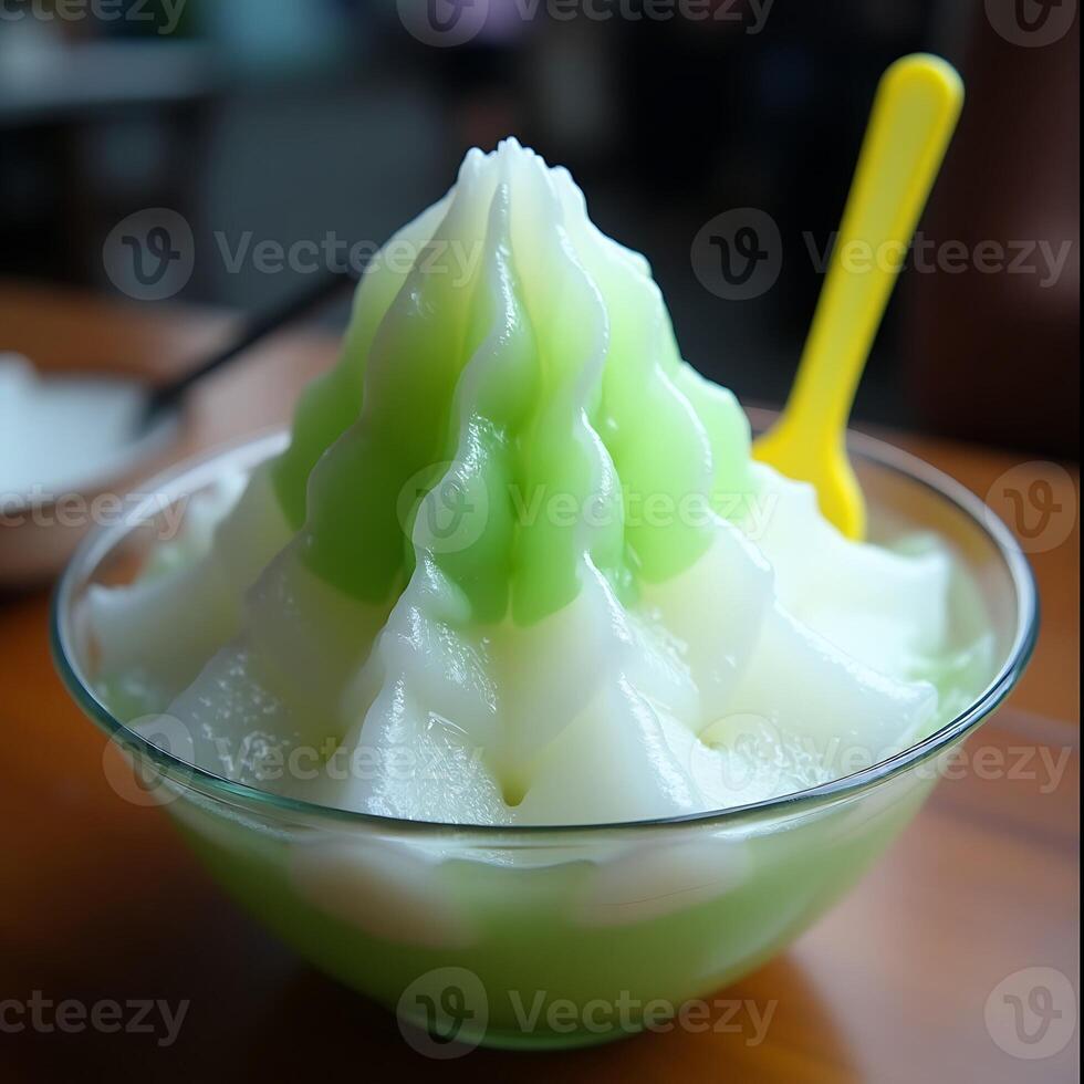 Shaved Ice Dessert with Green Melon Flavor in Glass Bowl photo