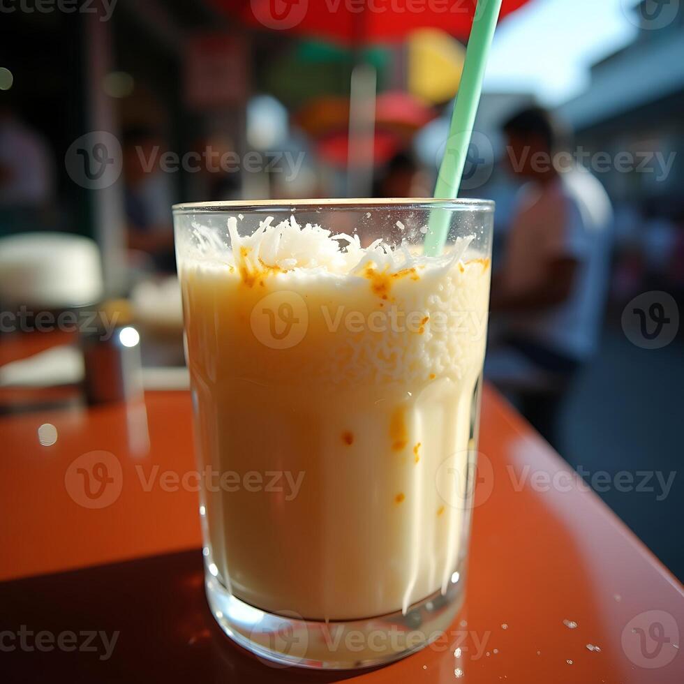 Refreshing Milkshake with Toppings and Straw on Bright Table photo