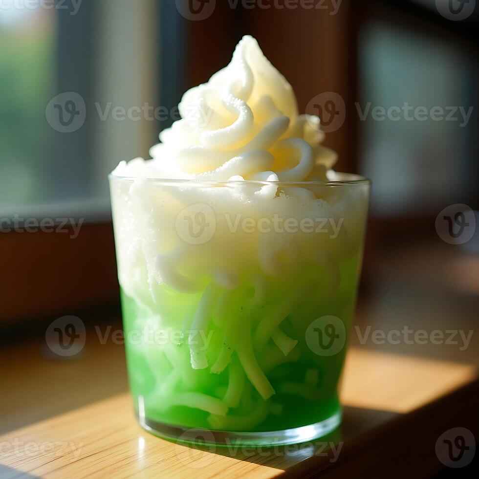 Refreshing Green Drink with Topping in Glass on Sunny Surface photo
