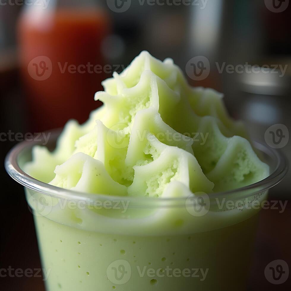 Refreshing Green Smoothie in Plastic Cup with Frosted Top photo