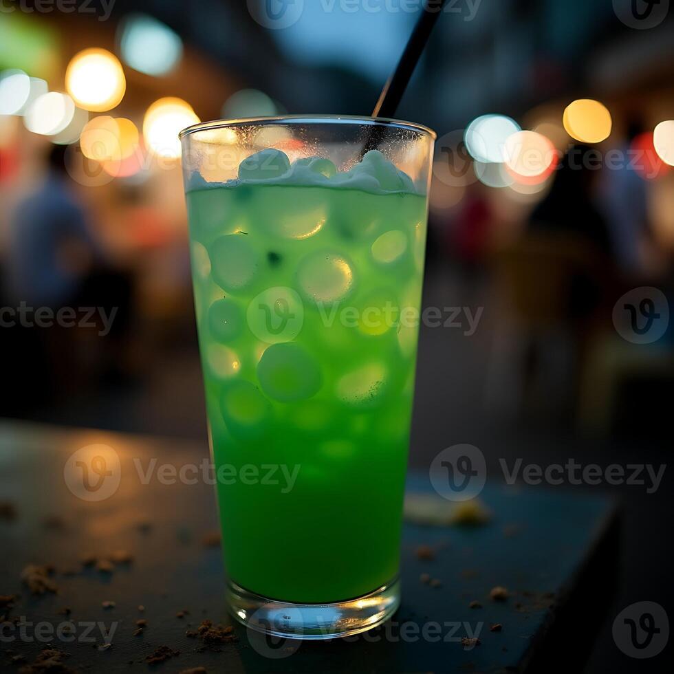 Enjoying Green Drink with Ice at Night Market photo