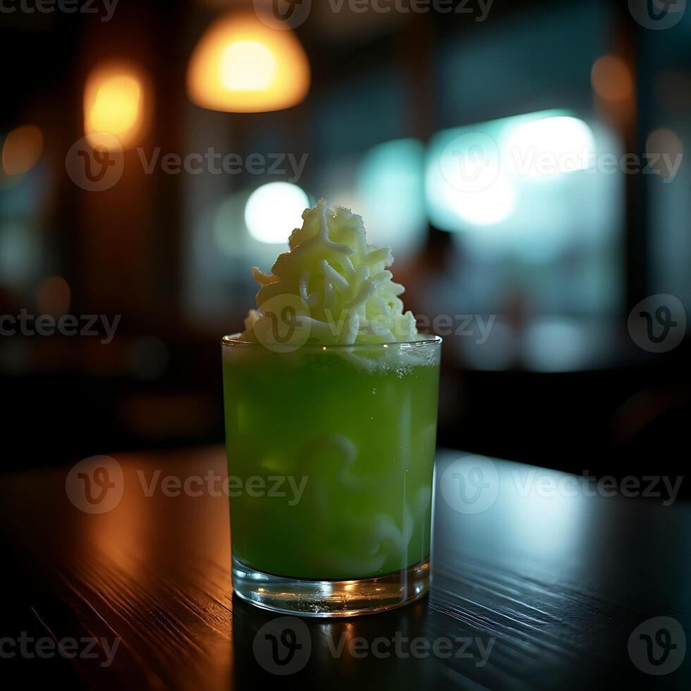Refreshing Green Drink with Whipped Topping on Table photo