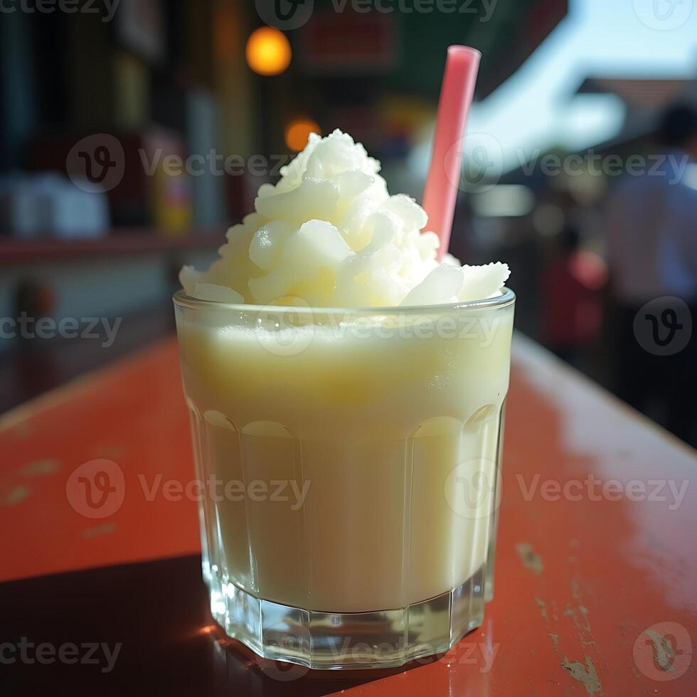 Refreshing Frozen Drink with Straw on Table photo