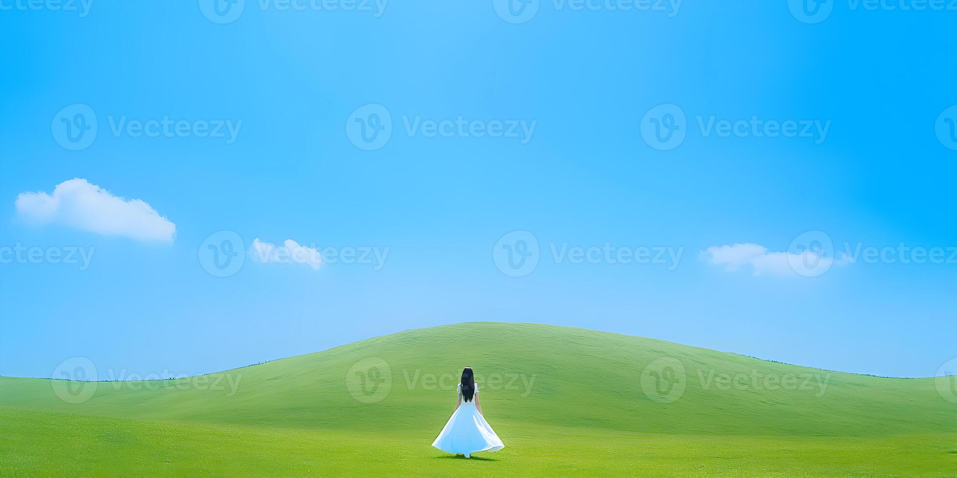 Woman in White Dress on Green Hill Under Blue Sky photo