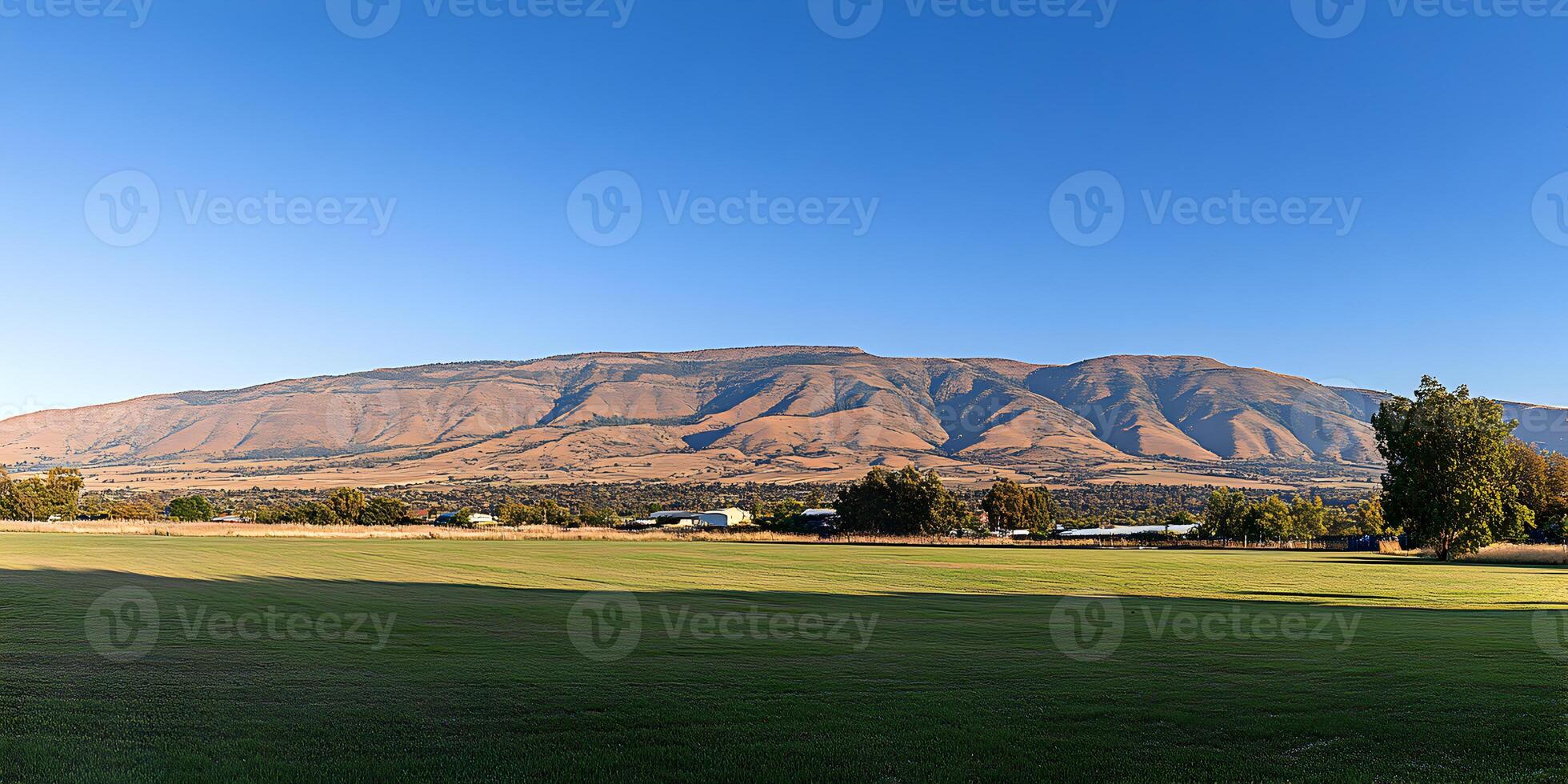 Scenic Landscape Green Field with Mountain Background photo