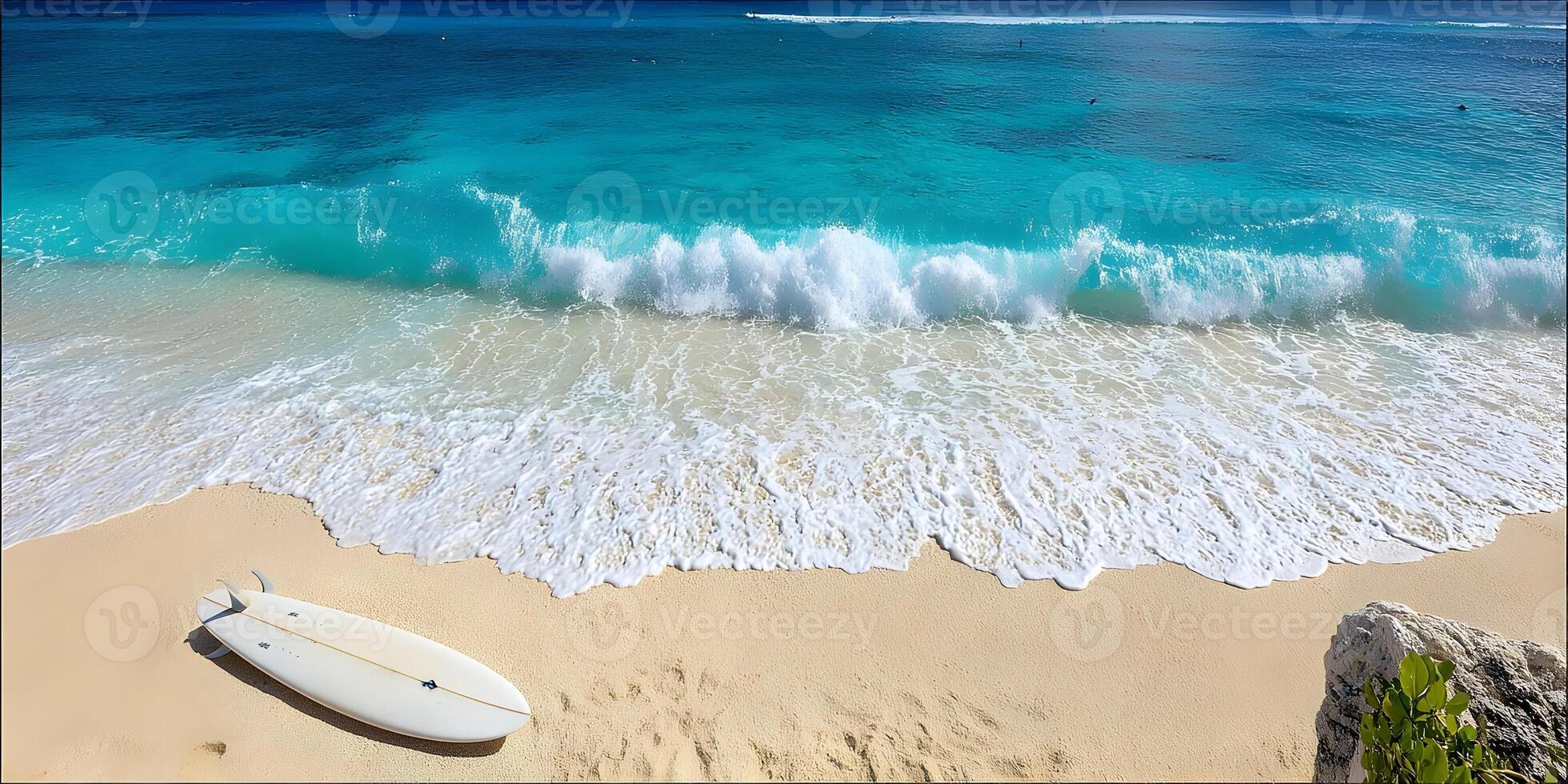 Surfboard on Sandy Beach with Turquoise Ocean Waves photo