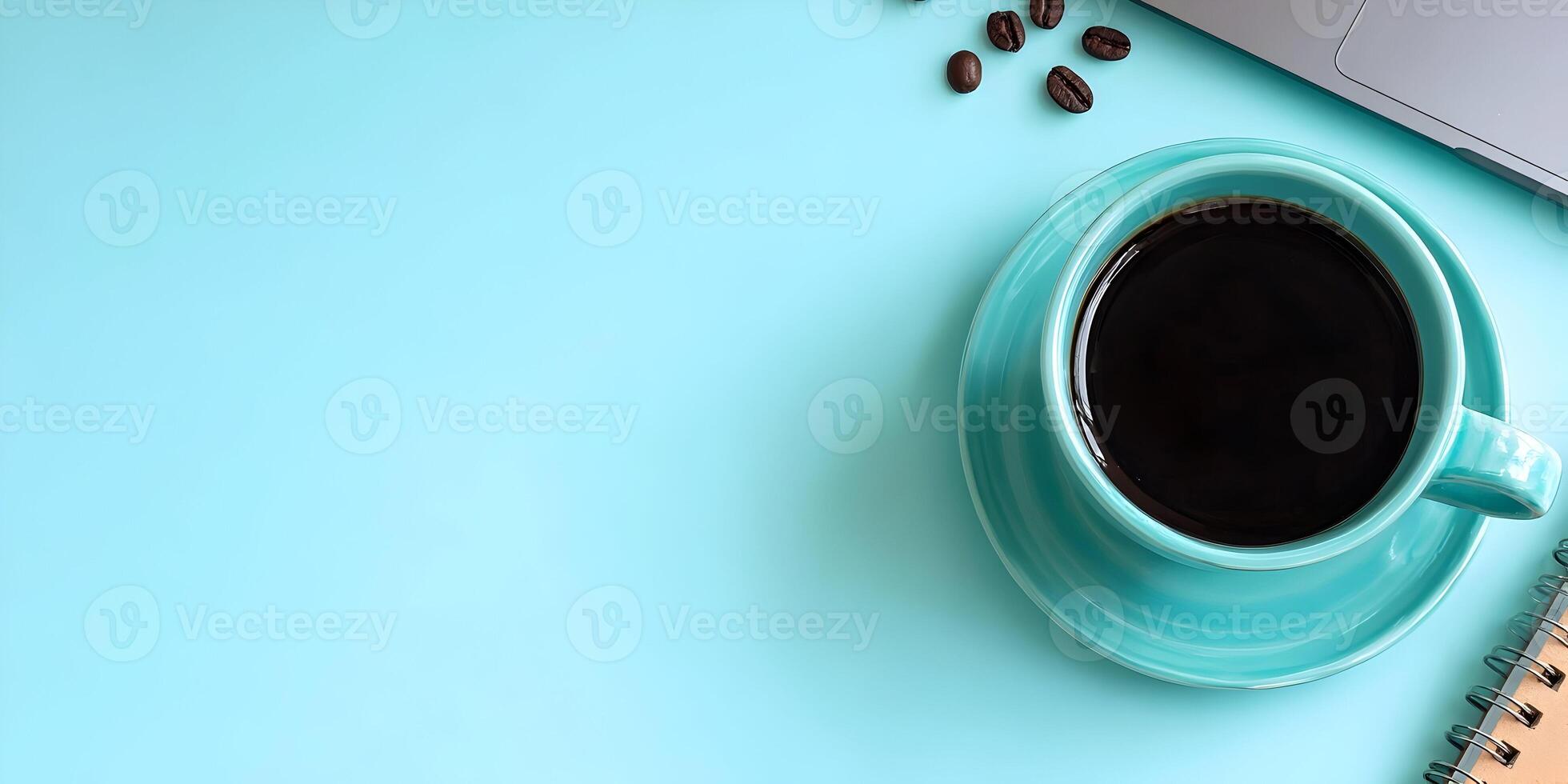 Teal Coffee Cup Black Coffee Notebook Laptop Coffee Beans Flatlay Blue Background photo