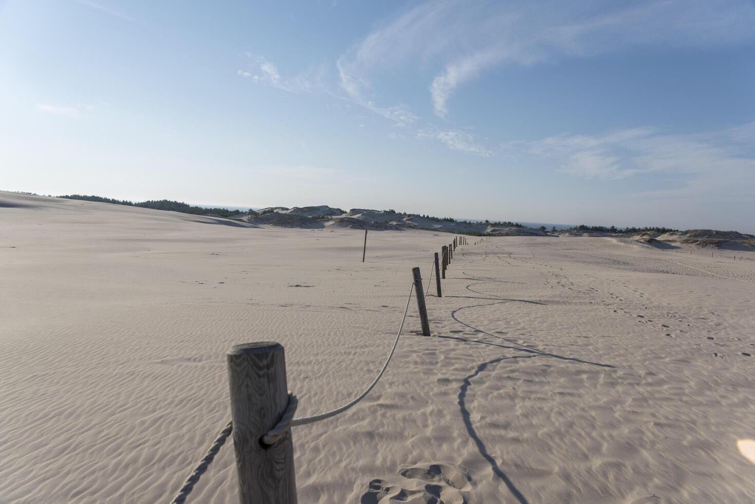 A fence with a wooden post photo