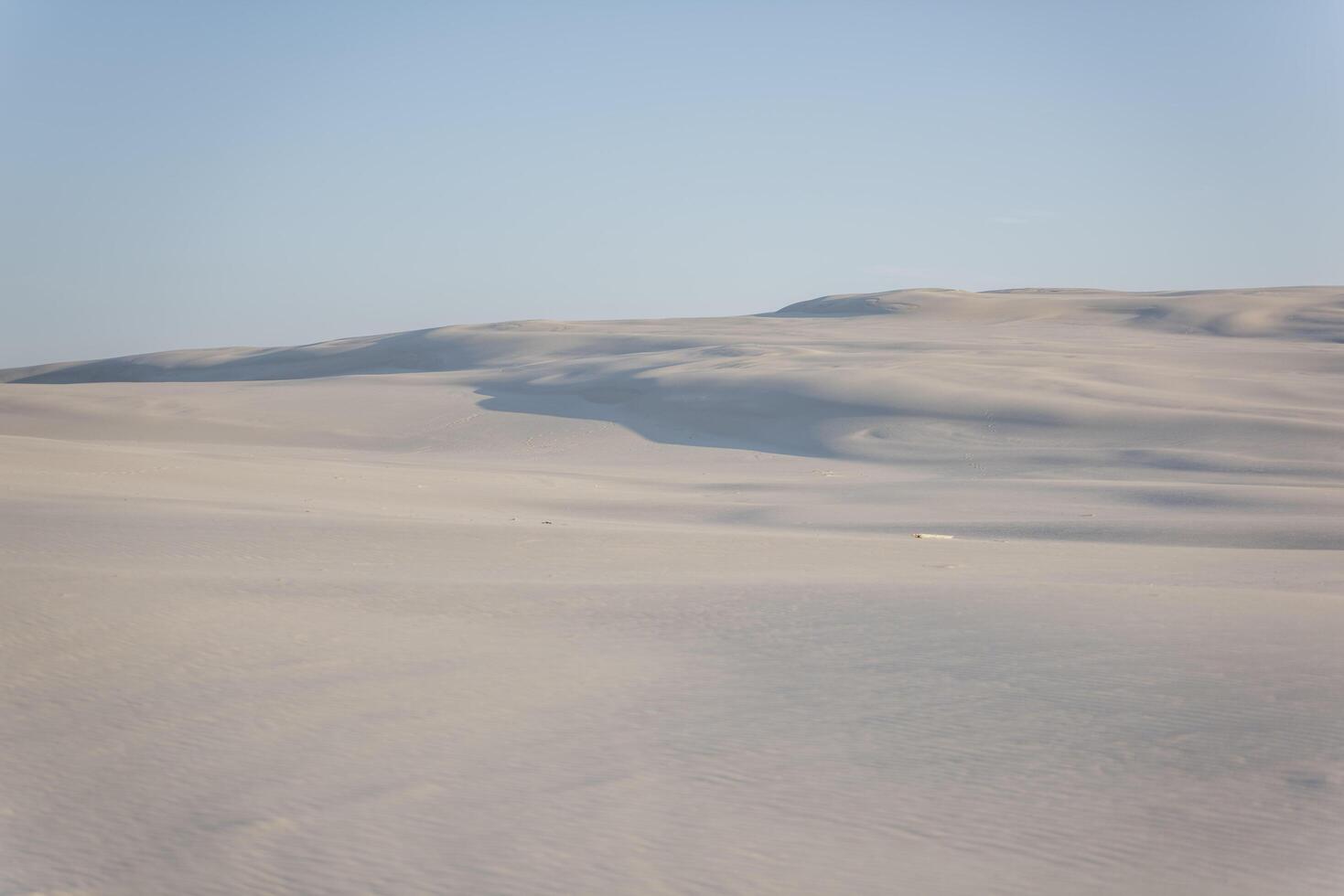 A person is walking in the sand photo