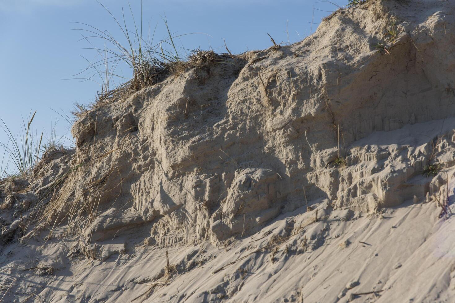 A man is standing on a cliff photo