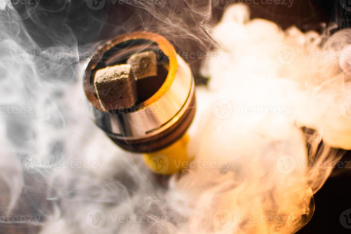 Close-Up of Smoking Hookah in Dimly Lit Room photo