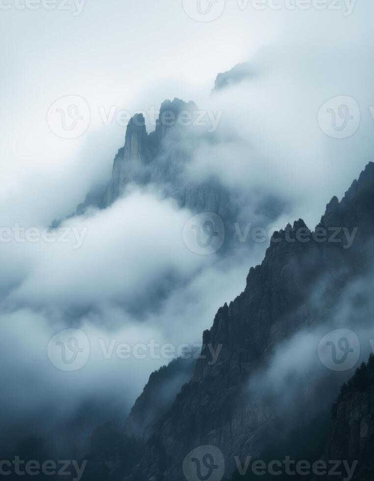 Misty Mountain Peaks, Jagged rocks emerge from dense fog creating an ethereal atmosphere photo