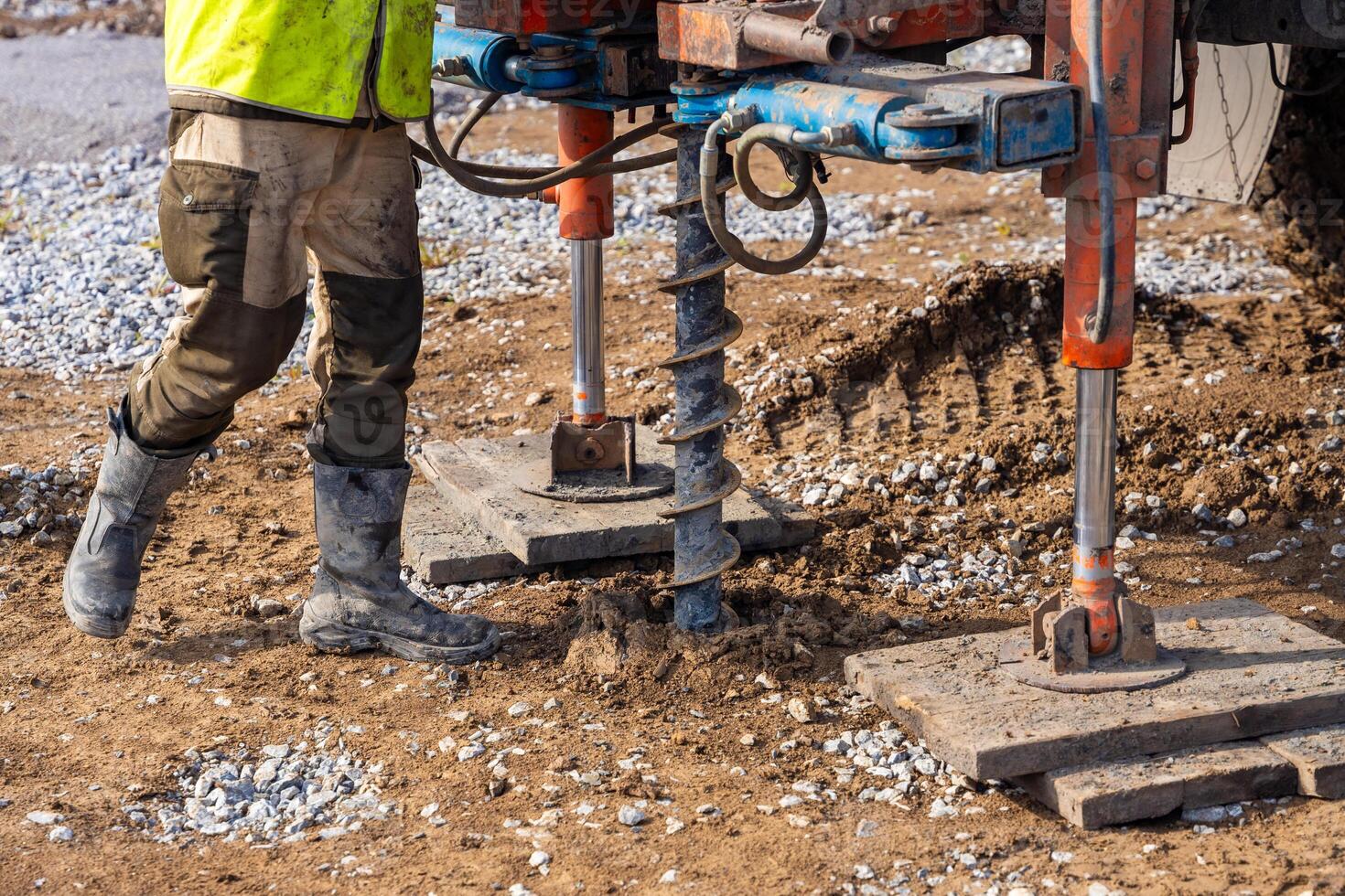 Close-up of soil sampling during pile drilling process. Extraction of subsurface material for geotechnical analysis and foundation assessment. High quality photo