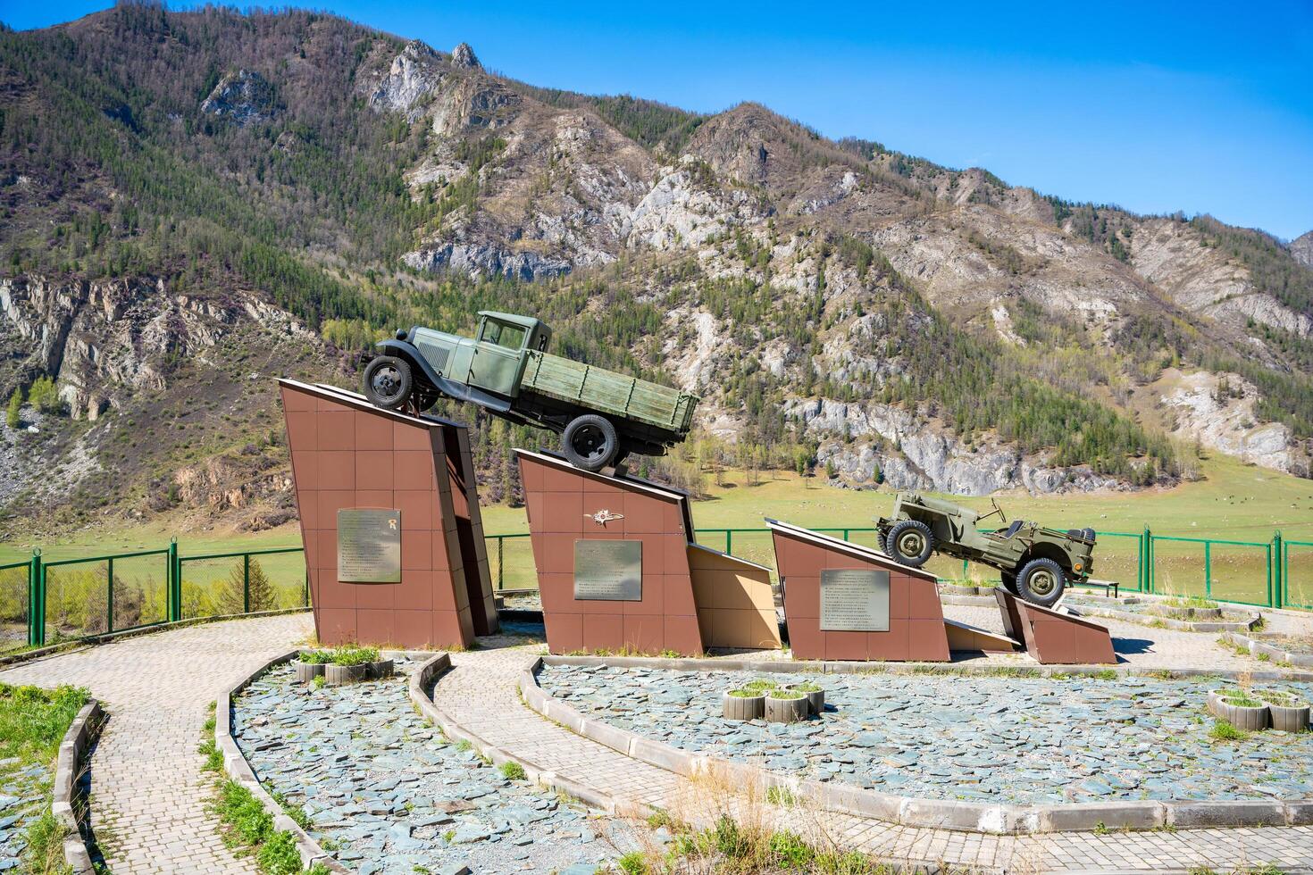 Altai, Russia - May 9, 2025. A monument to military equipment in the Altai Mountains commemorating the role of transport during World War II. A symbol of endurance, logistics and military history photo