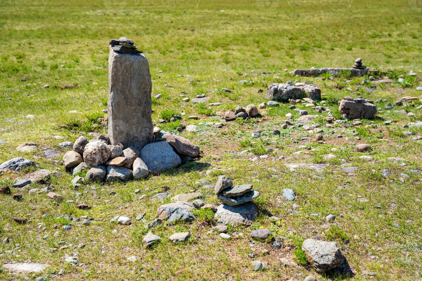 Vertical stone slabs known as Inin steles forming a sacred site near Chuysky Trakt Altai Russia. Spiritual monument used for prayers and worship by Altai people. High quality photo