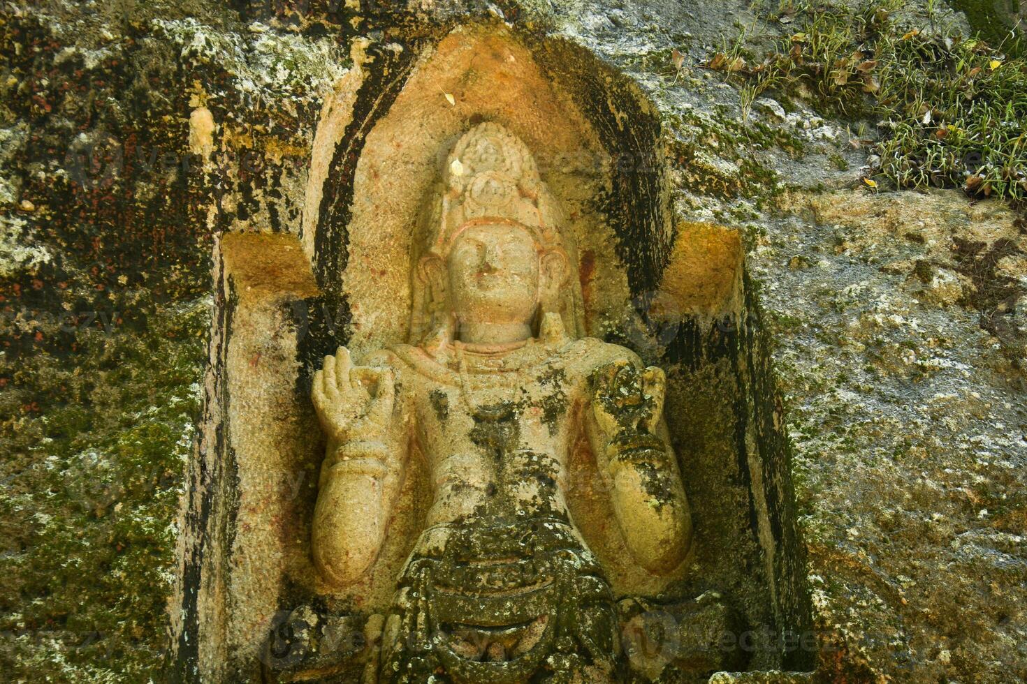 Kushtarajagala Ancient rock-carved statue in Weligama, Sri Lanka, believed to depict Bodhisattva or healing king. A unique symbol of Sri Lanka Buddhist heritage and early stone artistry photo