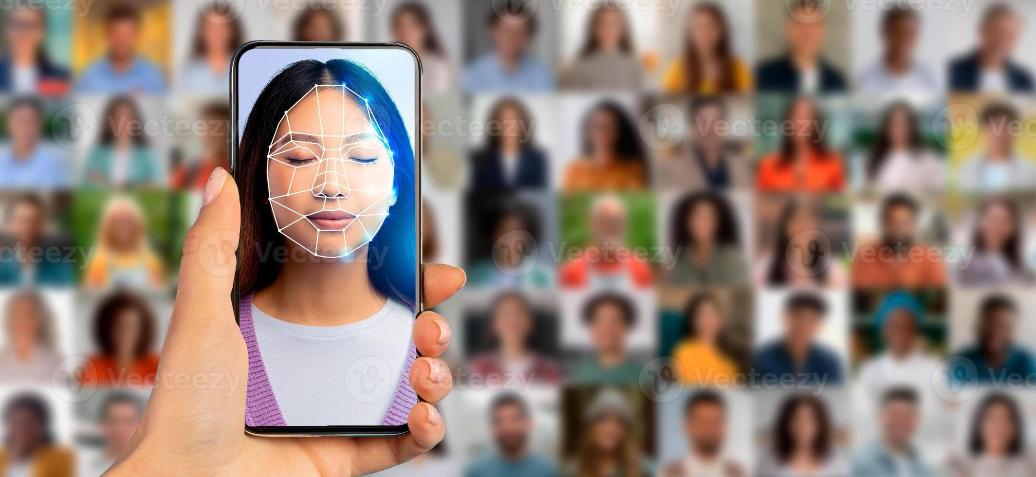 A hand holds a smartphone displaying a facial recognition scan of a woman. In the background, a collage of diverse portraits highlights the evolution of identification technology. photo