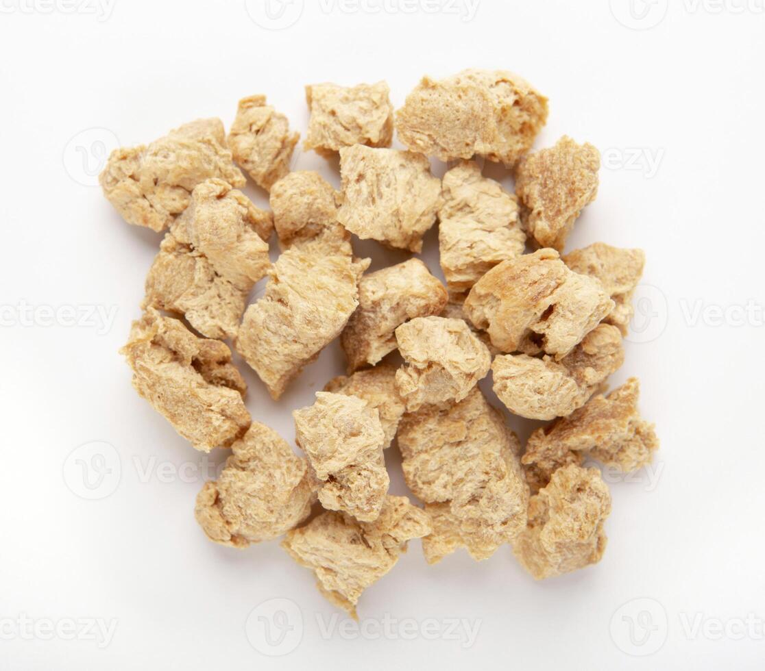 Alternative meat concept. Pile of soymeat protein isolated on white background, top view photo