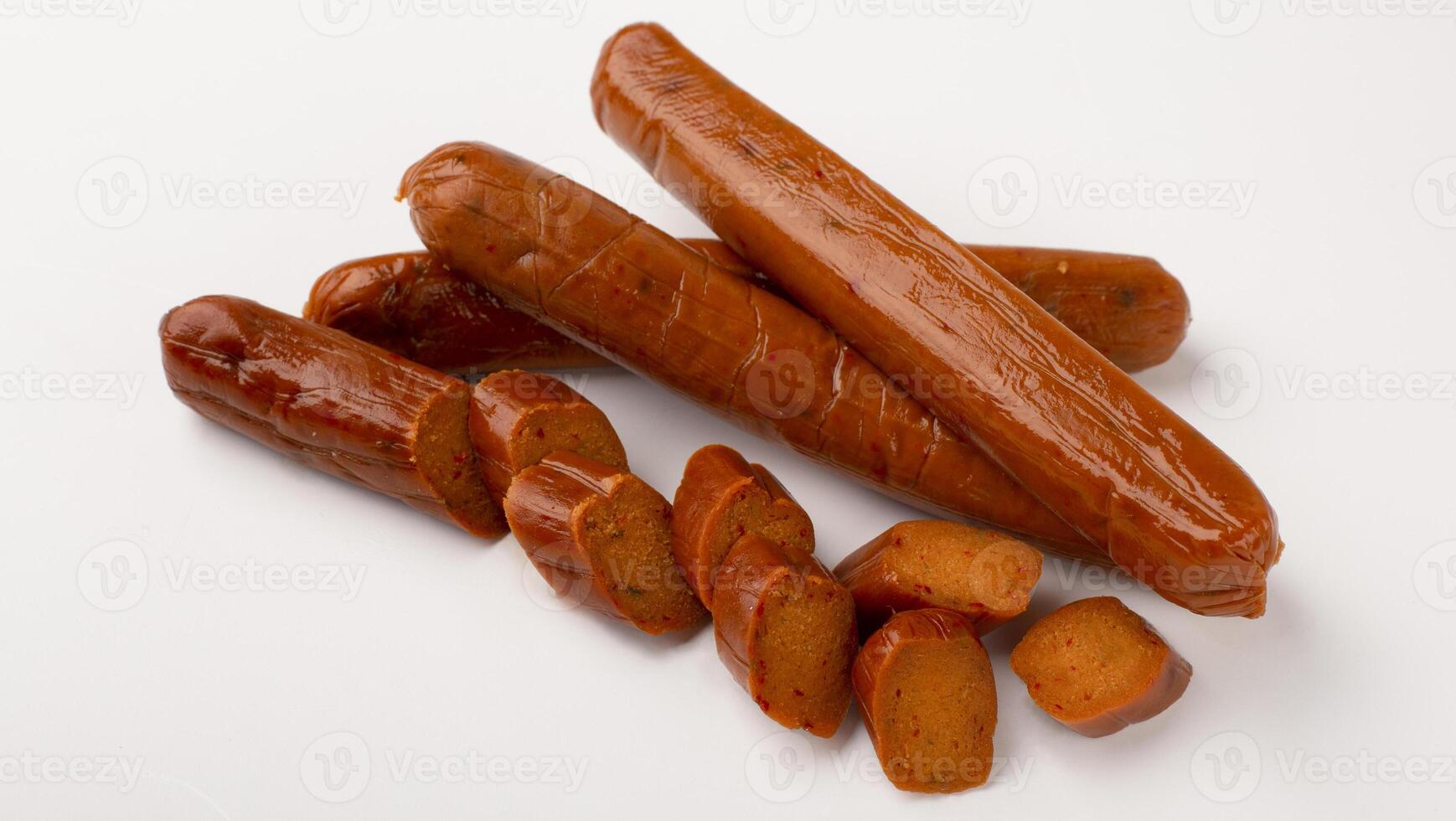 Food swap. Meat free smoked sausage isolated on white background, empty space photo
