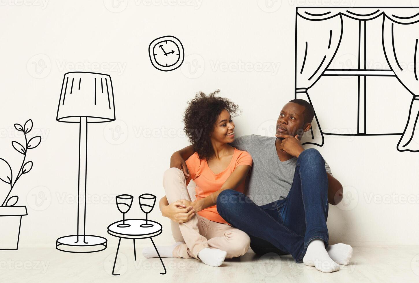 African American couple dreaming about their new apartment interior, collage with sketch drawings of furniture on white wall photo