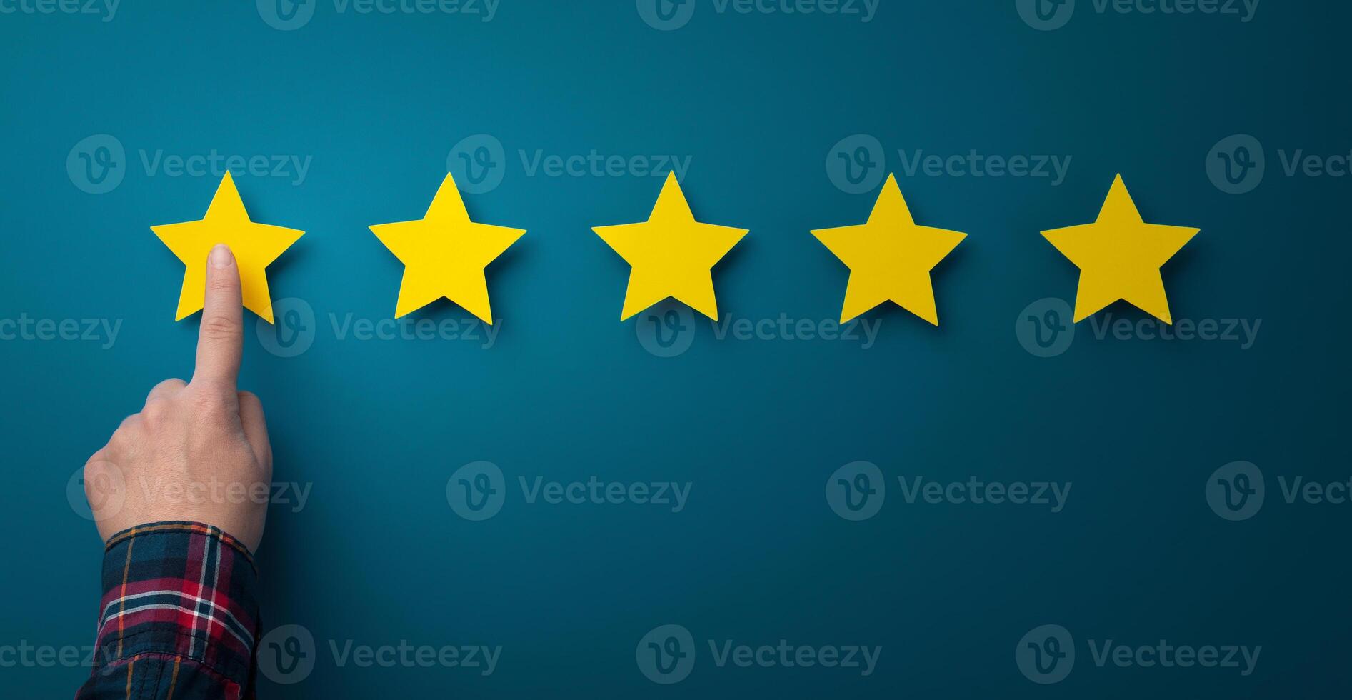 Evaluation concept. Finger rating company service and giving five stars, blue background, panorama photo