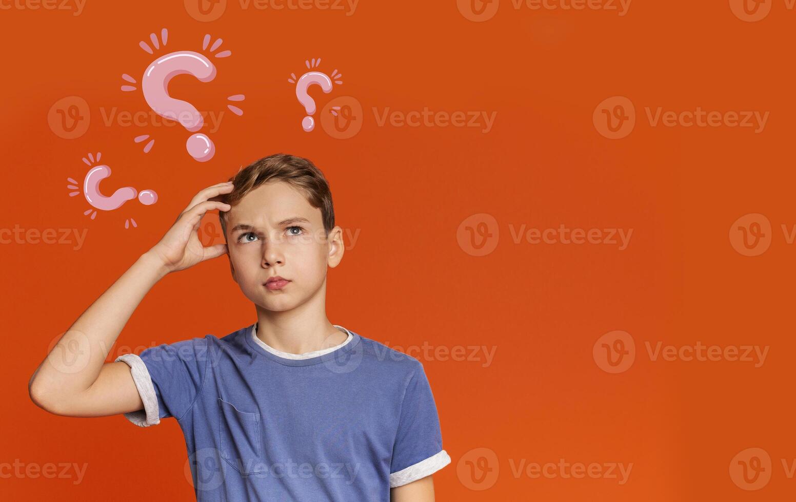 Thoughtful Caucasian teenager searching for creative solution to problem on orange background, collage with question marks. Copy space. Smart ideas and innovative decisions concept photo