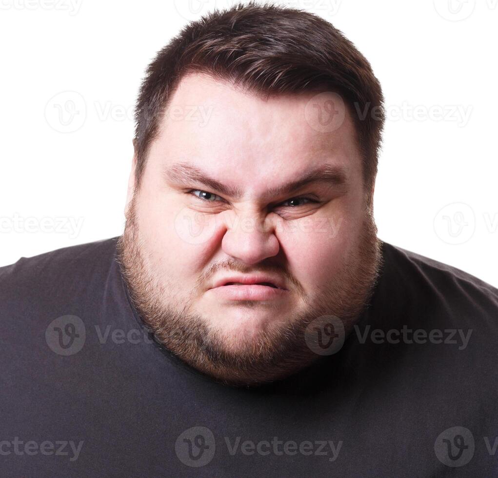 Angry fat man portrait, furious big guy expressing anger, white isolated studio background photo