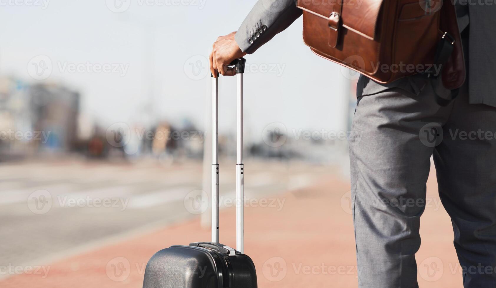 Unrecognizable Gentleman On Business Journey Standing With Suitcase Outdoors In City Waiting For Taxi To Airport. Panorama, Cropped, Copy Space photo