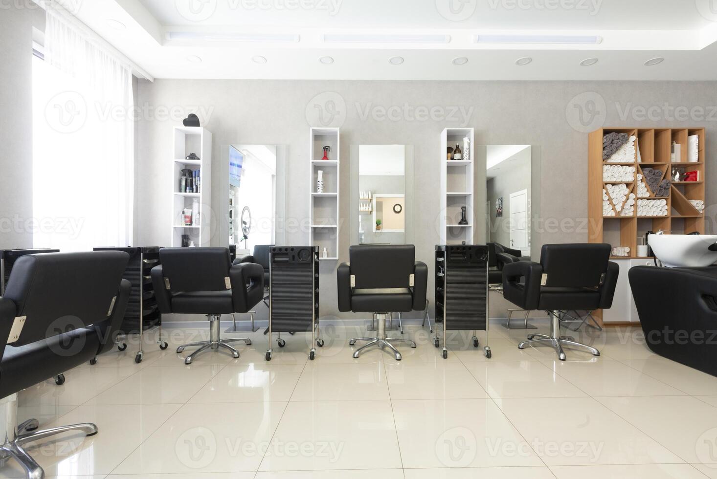 Workplace hairdresser in bright beauty salon, free space photo
