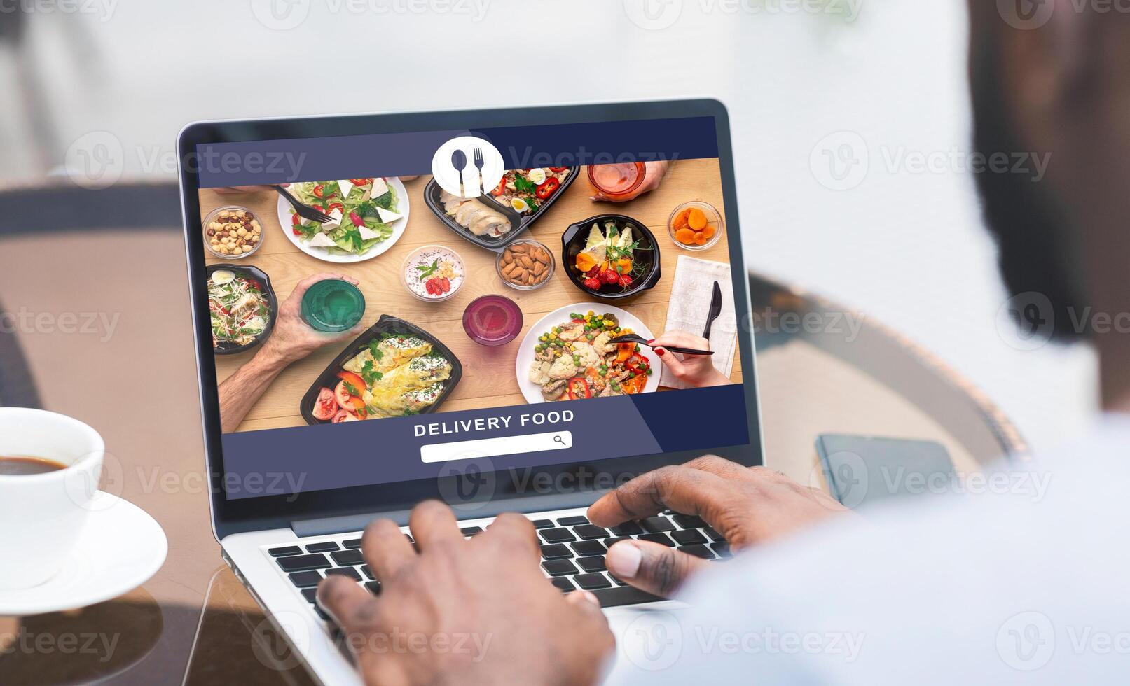 Modern food and fast delivery at home or office. African american man uses laptop and order meal on website at screen of gadget, sitting at table with coffee and smartphone, collage, collage, cropped photo