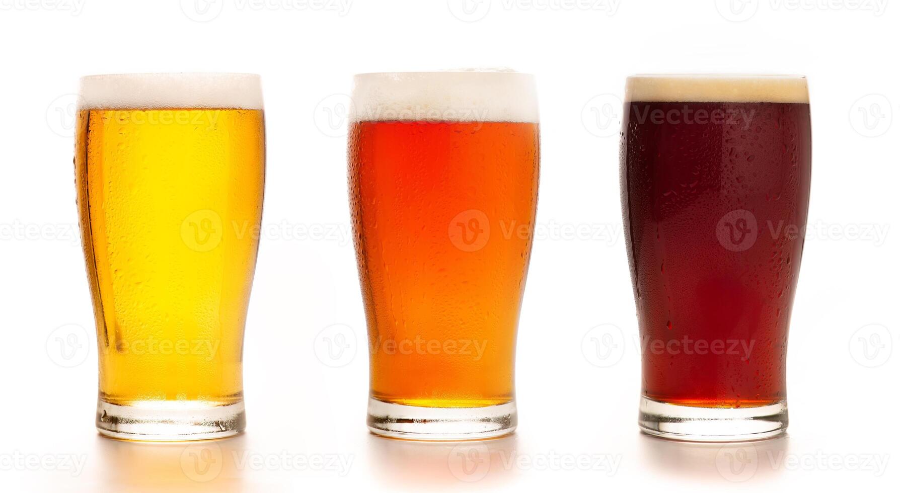 Different types of craft fresh drink. Assortment of beer in tall glasses. Light, barley and dark lager in glasses, isolated on white background, mockup, studio shot, close up, free space photo