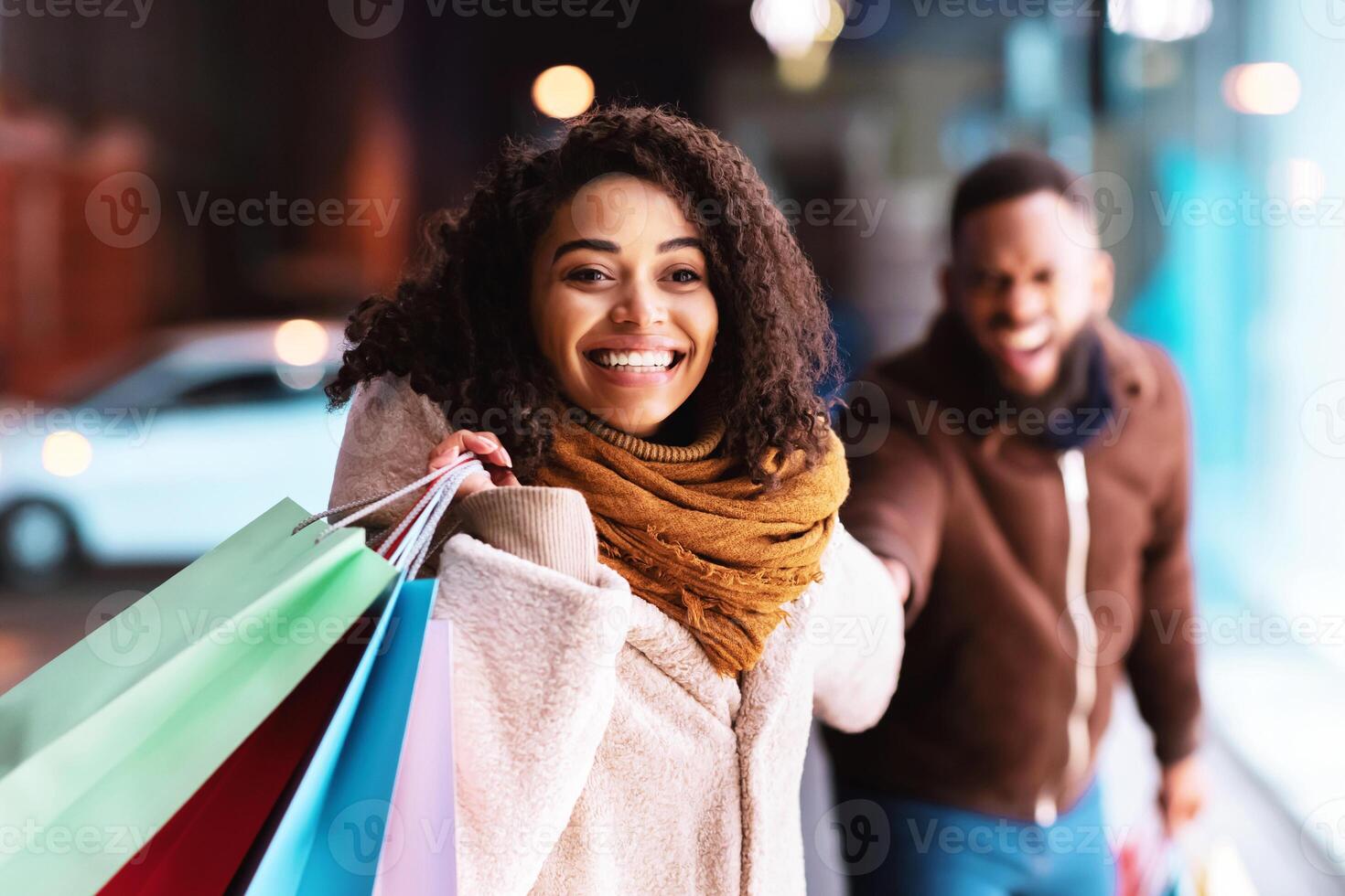 Sales Season. Portrait Of Smiling Excited Black Woman Pulling Boyfriend To Shopping Store To Buy New Clothes, Fooling And Running To Mall Together. Discount, Fun, Purchase And Retail photo