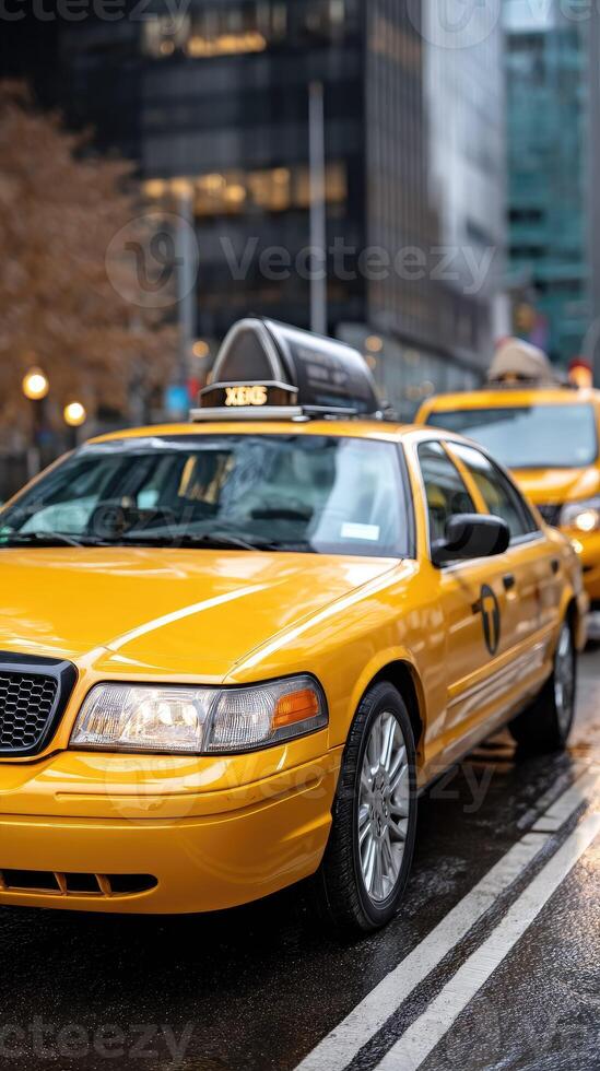 A yellow taxi cab is parked on the street photo