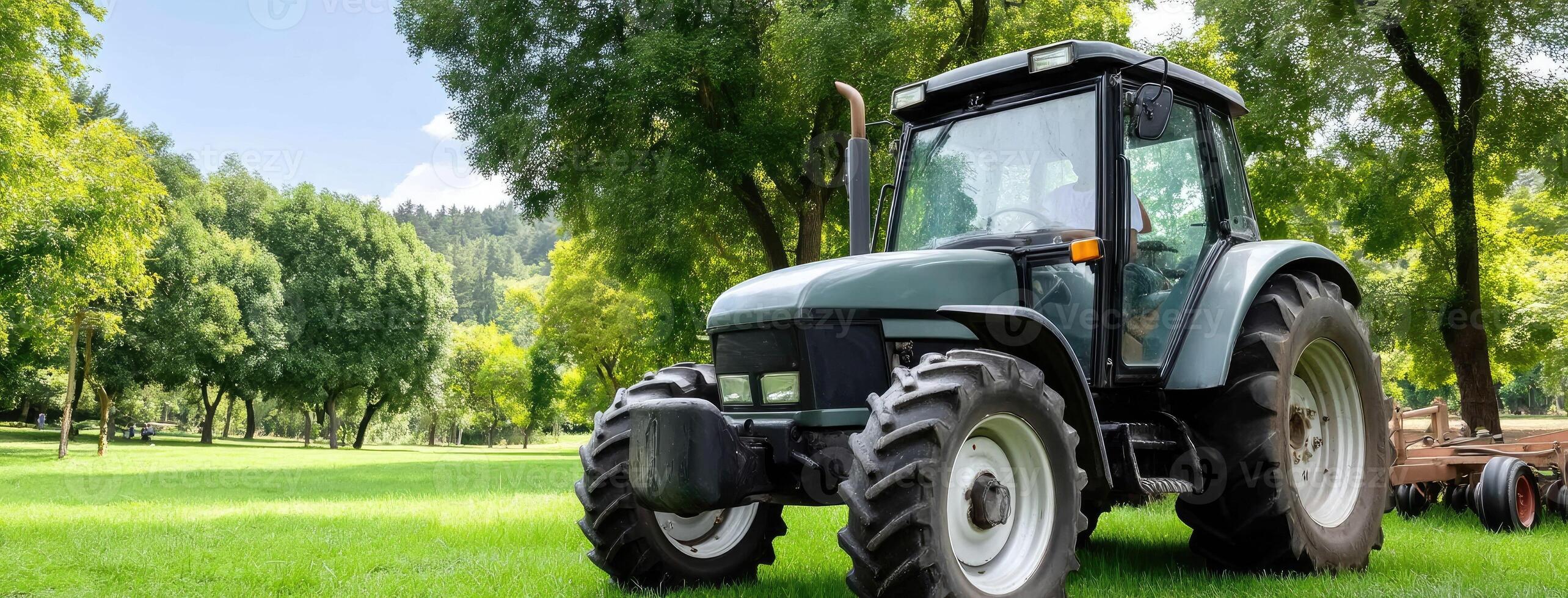 A tractor is parked in the middle of a green field photo