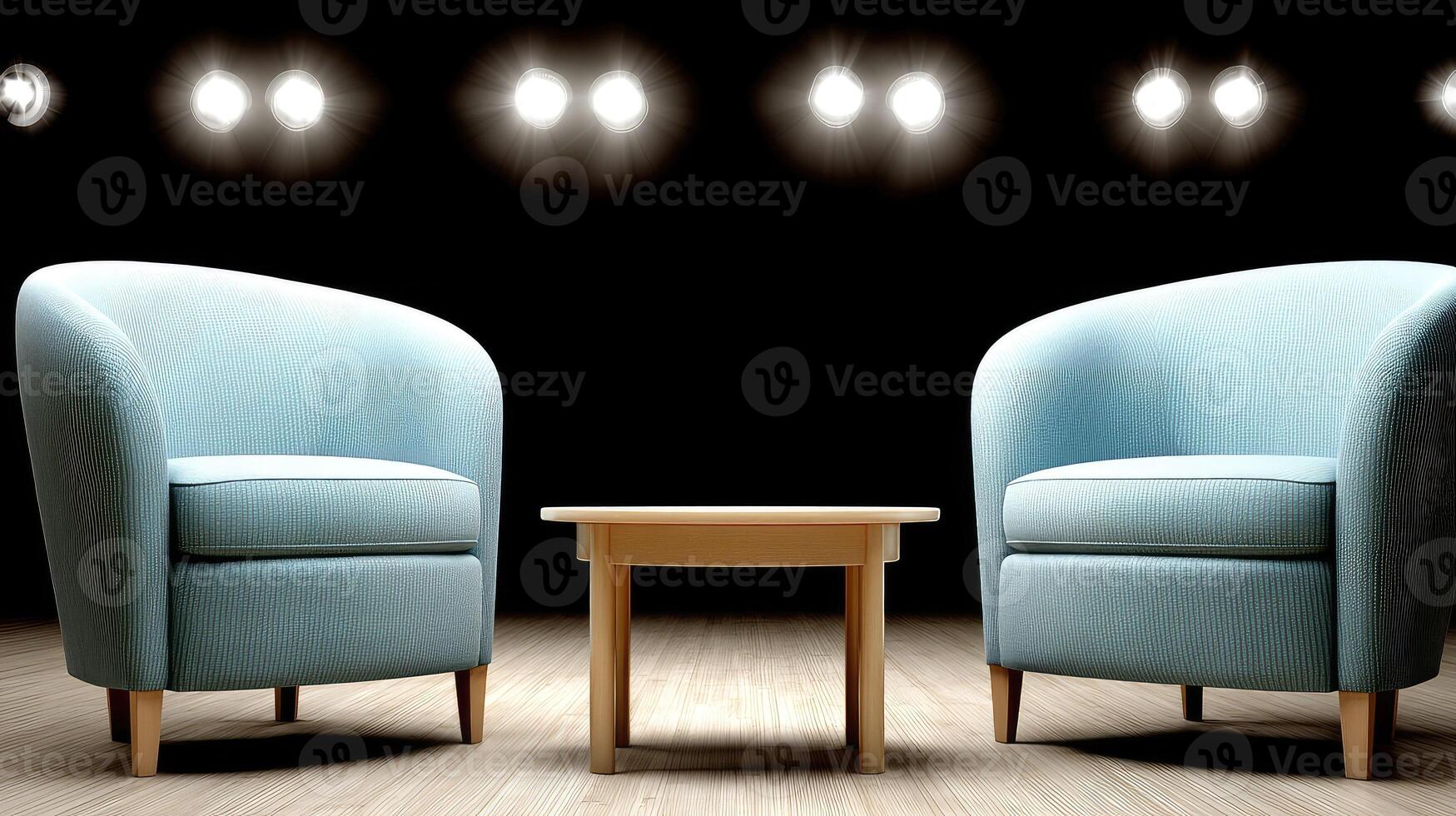 Two chairs and a table in front of a spotlight photo