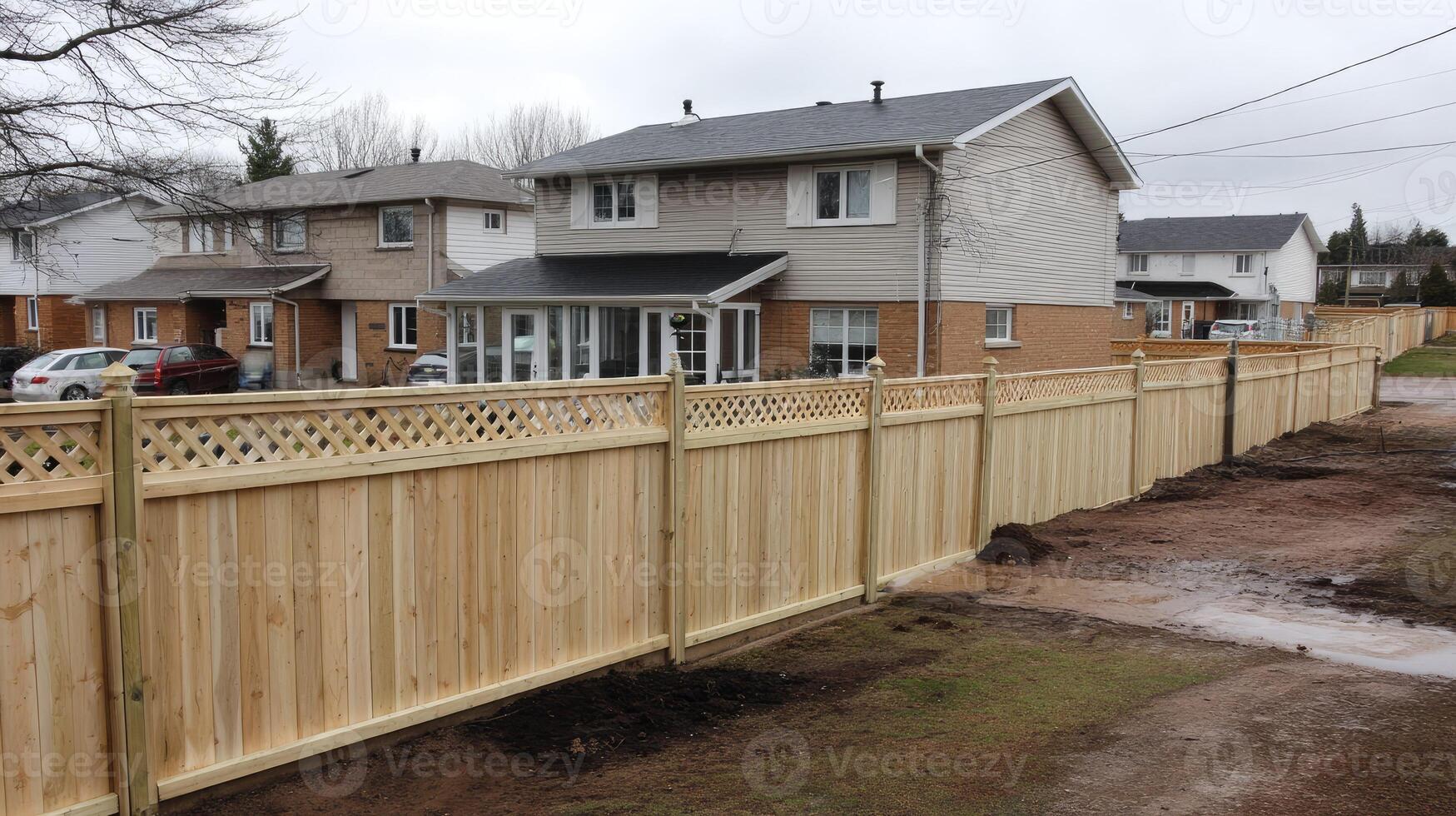 A fence is being built in front of a house photo