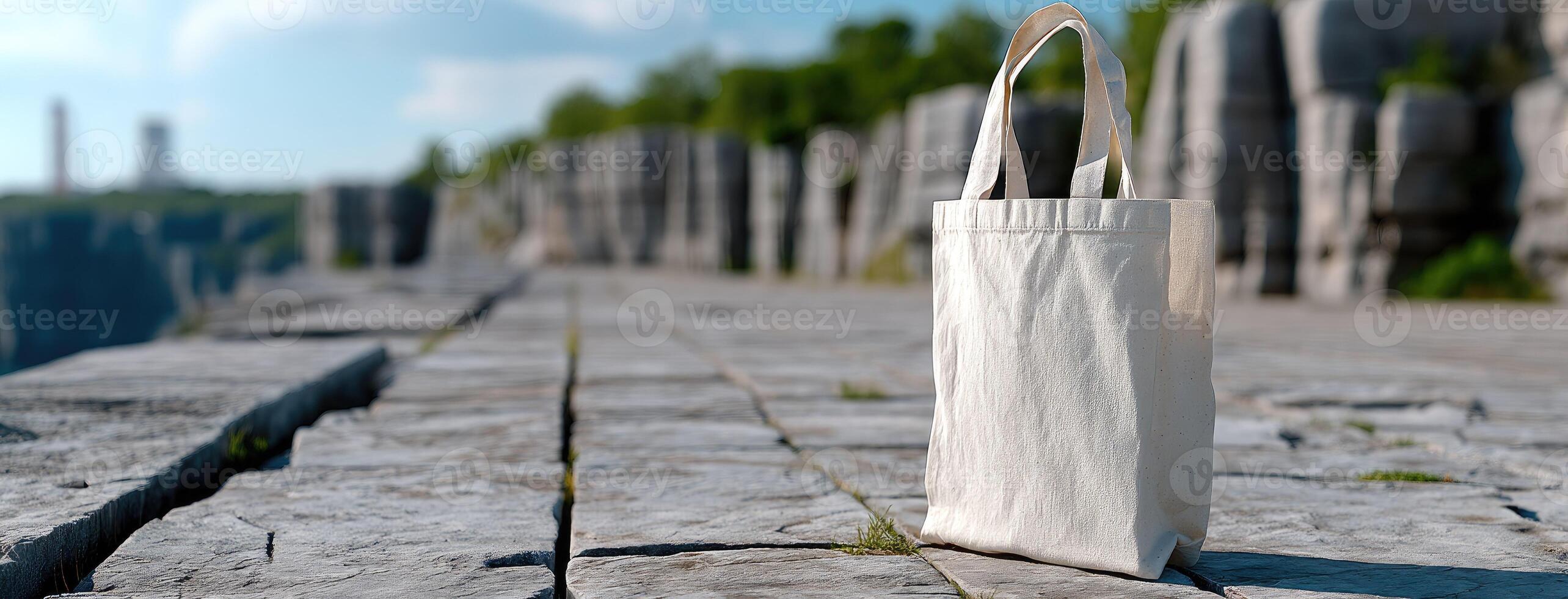A white bag sitting on a stone ledge photo